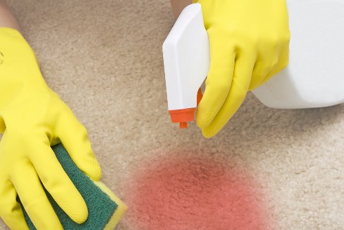 Deep cleaning a stained carpet in a Watford business space with professional equipment