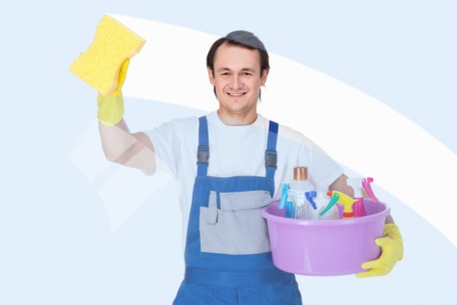 Carpet cleaning technician working safely in a Watford property