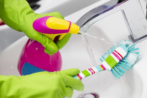 Insured carpet cleaning team in Watford with safety equipment