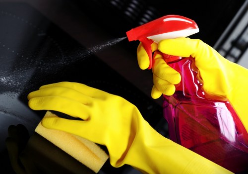 Local technician cleaning a corner sofa in Watford